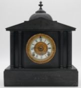 A 19th century slate mantel clock of architectural form with eight day movement. H.40cm