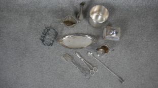A miscellaneous collection of silver plated items to include toast rack, cream jugs, tray etc.