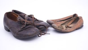 Two pairs of antique leather children's shoes, one with button fastening and one with laces. L.18cm
