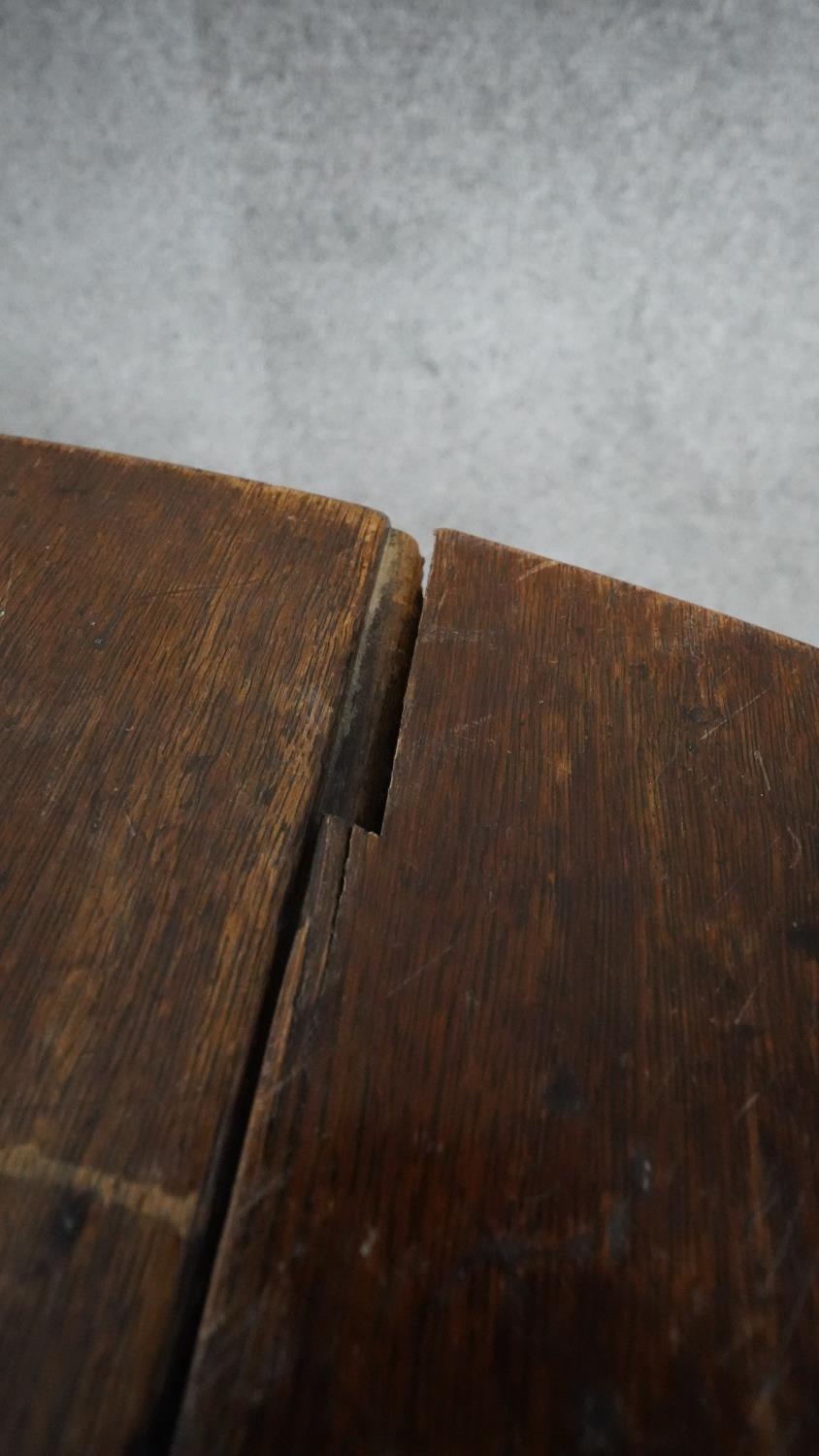 A Georgian oak drop flap dining table on pad foot supports. H.72 W.110 D.45 Ext.113 - Image 9 of 10