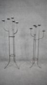 Two wrought iron six branch floor standing candelabras with abstract branched design. H.110cm