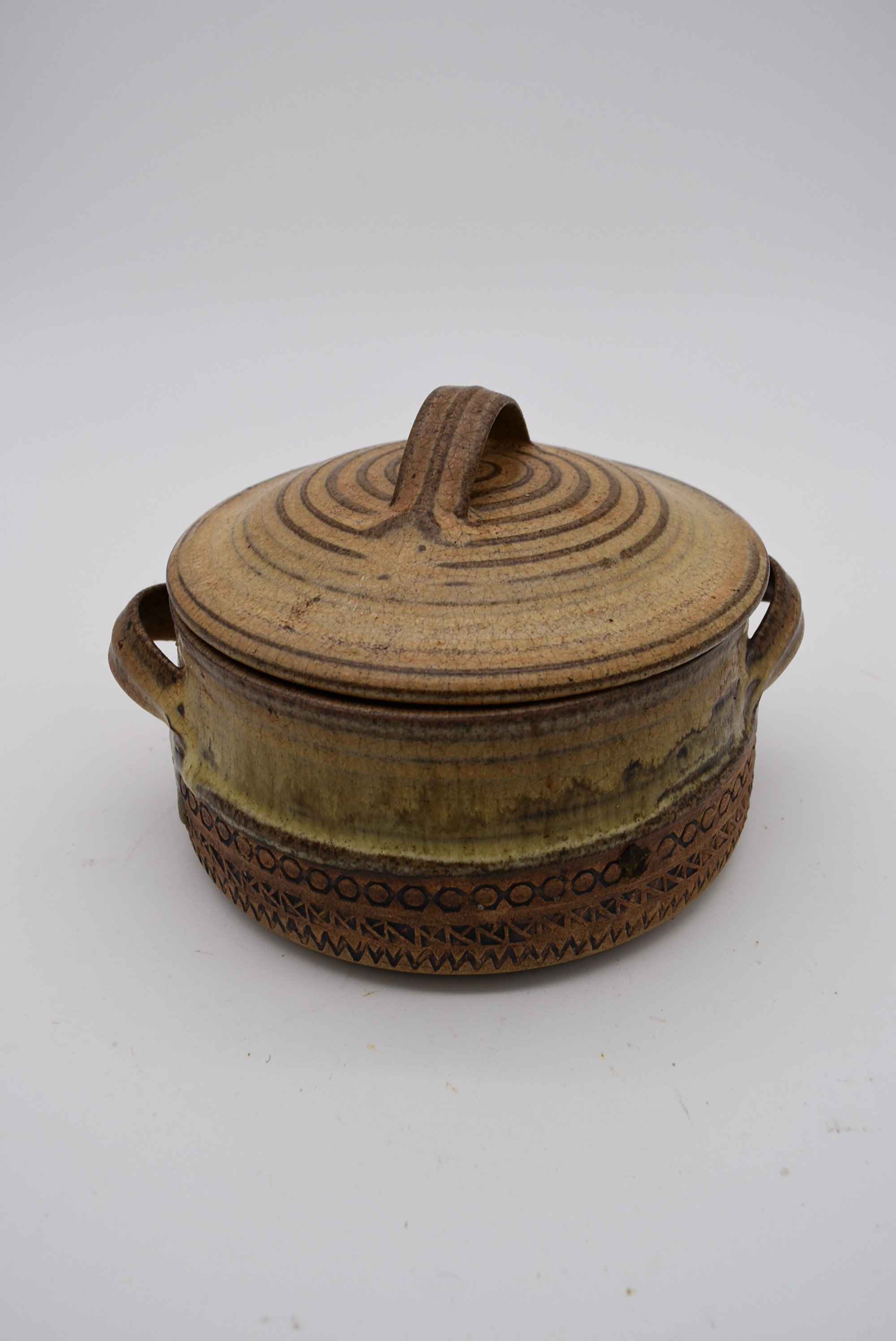 A lidded casserole pot, signed to base 'Dianne Sanders'