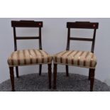 A pair of Georgian mahogany bar back dining chairs.