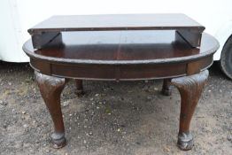 A C.1900 mahogany extending dining table with extra leaf.