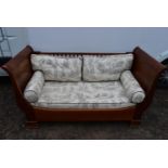 An Empire style two seaster mahogany sofa.