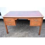 A mid century reak pedestal desk with inset leather top.