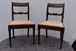 A pair of Georgian mahogany bar back dining chairs.
