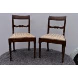 A pair of Georgian mahogany bar back dining chairs.