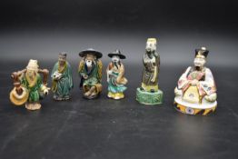 A collection of Chinese ceramic figures. Including a porcelain Royal Worcester emperor figure, and