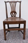 A Georgian country oak dining chair.