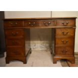 A Georgian style mahogany three part pedestal desk.