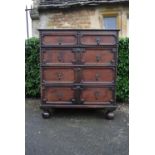 A Jacobean style oak chest of drawers.