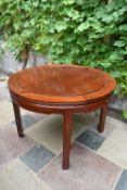 A Chinese hardwood circular dining table. Extends but has no leaves.