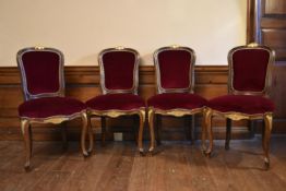 A set of four Louis XV style upholstered dining chairs.