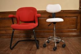 A Herman Miller desk chair and a modern office chair.