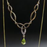 9 carat gold diamond and peridot set necklace. 46 cm long. 1.8 grams. UK Postage £10