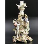 Large 19th century Dresden German porcelain, floral encrusted figural candlestick. 33cm high. UK