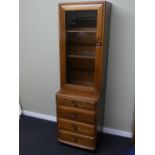 Ercol Windsor elm display cabinet over a four drawer base. Ercol seal to the inside of the door. 160