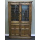 Ercol Grasmere elm bookcase/display cabinet, featuring two internal spotlights, bevelled glass doors