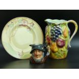 A Sylvac jug, Clarice Cliff plate "Chippendale Trees" and a Royal Doulton Rip Van Winkle character
