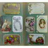 Two old postcard albums, containing a good selection of cards (285 in total), including humorous,