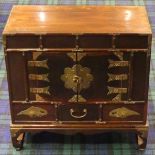 Old Chinese mahogany and pine brass embellished cupboard over three drawers. 60 x60 29 cm.