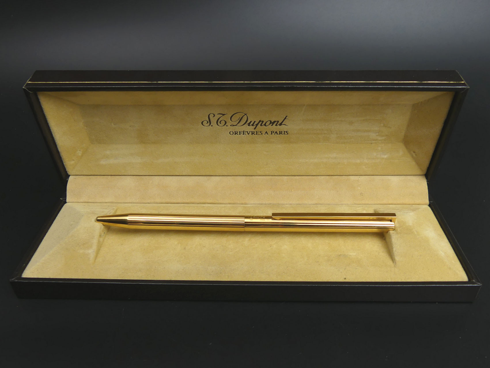 ST. Dupont boxed gold plated ball point pen. 13.5 cm long. UK Postage £12.