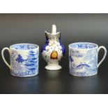 Two early 19th century Wedgwood blue and white pottery coffee cans and a Gaudy Welsh cream jug. UK