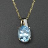 9 carat gold blue topaz and diamond pendant and 46 cm chain. 2.5 grams. Pendant 16 mm long x 8 mm