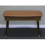 Retro teak coffee table on black tapering legs and with a swivel top, which opens to reveal a