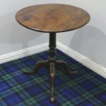 A Georgian mahogany tilt-top tripod table, 64 cm diameter. Collection only.