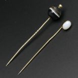 Victorian banded agate stick pin and a similar opal example both in yellow metal. 5.2 grams. 70 mm