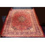 Red ground Persian Kashan carpet, with a medallion design. 395 cm x 200 cm. Collection only.