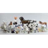 A collection of pottery and porcelain animals, including Royal Copenhagen and Beswick. Collection