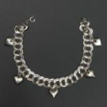Sterling silver open link heart drop bracelet. 19.5 cm long. 10 mm wide (excluding hearts). 16