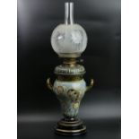 Doulton Lambeth art pottery twin handled oil lamp, Emily Welch and Harriet Hibbut, circa 1885. 66 cm