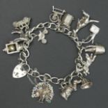 Vintage Sterling silver charm gate bracelet, Birm.1973. 51 grams. UK Postage £10.