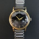 Vintage gold tone Gloriosa Extra black face, automatic 25 jewel movement, date adjust wristwatch.