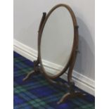 A Victorian mahogany oval dressing table mirror. 58 cm high x 47 cm wide. Collection only.