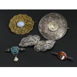 Five brooches, including a silver and enamel bar brooch, along with a silver and turquoise