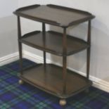 Ercol elm tea trolley on castors. 71 cm wide x 46 cm high. Collection only.