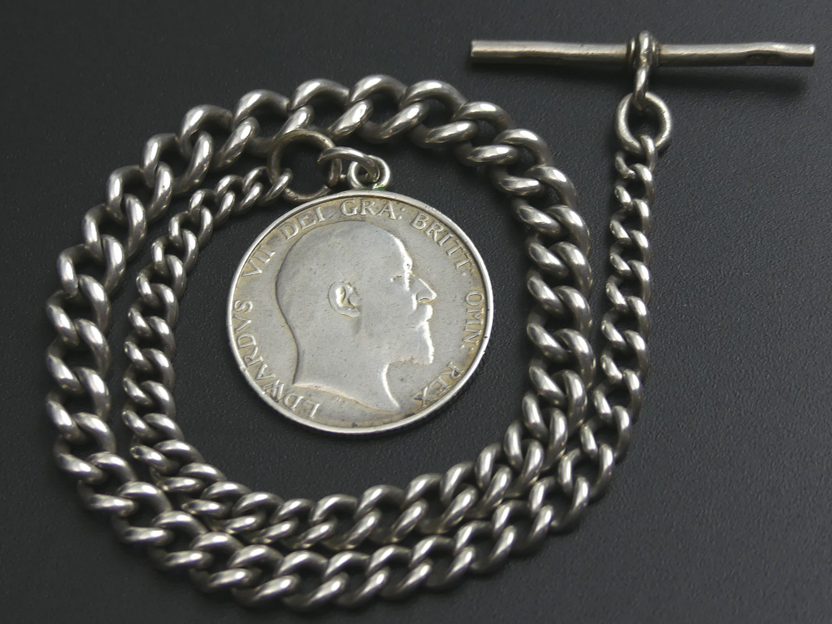 Edwardian silver graduated curb link pocket watch Albert chain and enamelled Shilling fob. 23.5 - Image 2 of 2