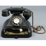 Unusual black Bakelite telephone with an internal bell box and line switching function. 19 cm