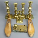 A Victorian brass lock, two pairs of brass candlesticks, a single example and a pair of shoe