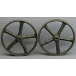 A pair of Victorian cast iron painted wheels. 30 cm in diameter. UK Postage £30.
