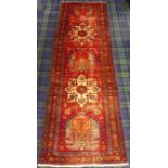 Vintage blue and red ground Persian Heriz runner with medallion decoration. 280 cm x 85 cm. UK