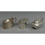 Three silver mustard pots, Chester 1920 (with matching spoon), London 1894 and Birmingham 1917.