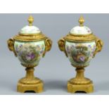 19th century gilt bronze and hand painted pair of vases and covers, probably Paris. 21.5 cm high. UK