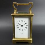Elkington & Co London, Paris made brass carriage clock. 15 cm to top of the handle. UK Postage £15.