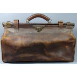 A Victorian brown leather Doctors bag with brass fittings. 57 cm long x 35 cm high. UK Postage £30.